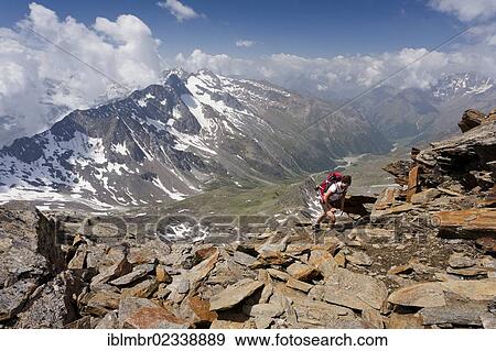 "Hiker during the ascent to Hochwilde Mountain, overlooking the Pfossen Valley, Val Senales, Alto Adige, Italy, Europe" View Large Photo Image Stock Photo - "Hiker during the ascent to Hochwilde Mountain, overlooking the Pfossen Valley, Val Senales, Alto Adige, Italy, Europe". Fotosearch