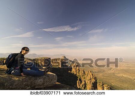 "Hiker enjoying the views of the Spandau-Koppe and the Camdeboo Plains, rock formations and stone columns in the Valley of Desolation, near Graaff Reinet, Eastern Cape, South Africa, Africa" View Large Photo Image Stock Image - "Hiker enjoying the views of the Spandau-Koppe and the Camdeboo Plains, rock formations and stone columns in the Valley of Desolation, near Graaff Reinet, Eastern Cape, South Africa, Africa". Fotosearch