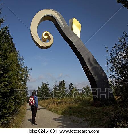 "Hiker in front of the sculpture The Crook on the WaldSkulpturenWeg trail in Schanze, Schmallenberg, Hochsauerlandkreis district, North Rhine Westphalia, Germany, Europe, PublicGround, Europe" View Large Photo Image Stock Image - "Hiker in front of the sculpture The Crook on the WaldSkulpturenWeg trail in Schanze, Schmallenberg, Hochsauerlandkreis district, North Rhine Westphalia, Germany, Europe, PublicGround, Europe". Fotosearch