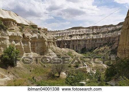Stock Photo - "Hiker in Pigeon Valley or Guvercinlik Vadisi, Goreme National Park, Nevsehir Province, Cappadocia, Central Anatolia Region, Anatolia, Turkey, Asia". Fotosearch