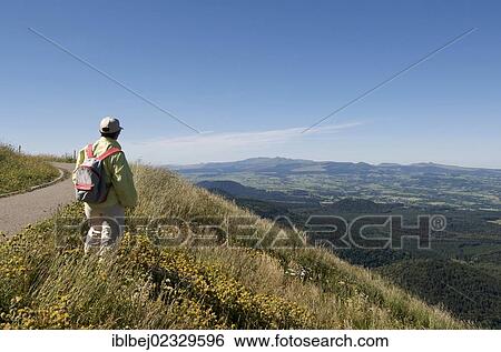 "Hiker looking at the Massif of Sancy, Auvergne, France, Europe" View Large Photo Image Stock Photograph - "Hiker looking at the Massif of Sancy, Auvergne, France, Europe". Fotosearch