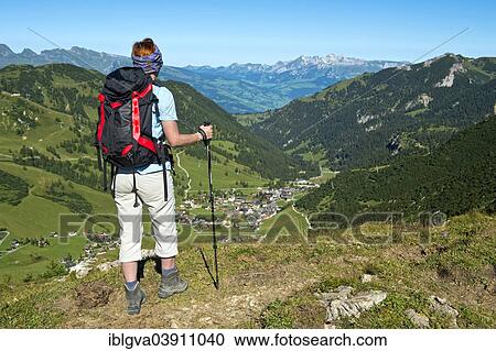 "Hiker looking into the Malbun Valley, high valley, Alpstein massif at the back, Principality of Liechtenstein" View Large Photo Image Stock Image - "Hiker looking into the Malbun Valley, high valley, Alpstein massif at the back, Principality of Liechtenstein". Fotosearch