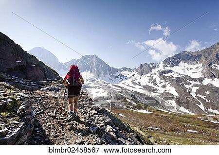 "Hiker on the Merano High Mountain Trail ascending to Hohen Wilden Mountain in Pfossental valley, Val Senales valley, Alto Adige, Italy, Europe" View Large Photo Image Stock Photo - "Hiker on the Merano High Mountain Trail ascending to Hohen Wilden Mountain in Pfossental valley, Val Senales valley, Alto Adige, Italy, Europe". Fotosearch