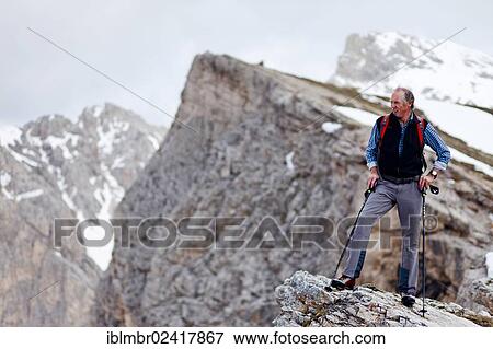 Hiker on the Pizzascharte wind gap, Dolomites, province of Bolzano-Bozen, Italy, Europe View Large Photo Image Stock Photo - Hiker on the Pizzascharte wind gap, Dolomites, province of Bolzano-Bozen, Italy, Europe. Fotosearch