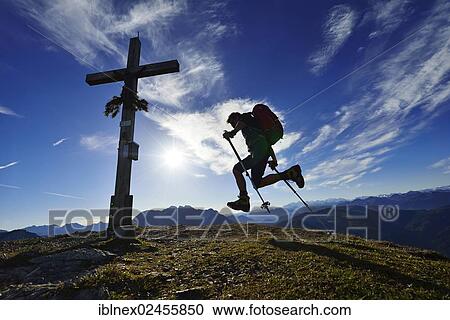 Stock Image - "Hiker on the summit of Mount Fellhorn, Reit im Winkl, Chiemgau region, Upper Bavaria, Bavaria, Germany, Europe". Fotosearch