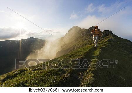 "Hiker on the summit of Mt Grosser Galtenberg in the evening light, Alpbachtal valley, Tyrol, Austria, Europe" View Large Photo Image Stock Image - "Hiker on the summit of Mt Grosser Galtenberg in the evening light, Alpbachtal valley, Tyrol, Austria, Europe". Fotosearch