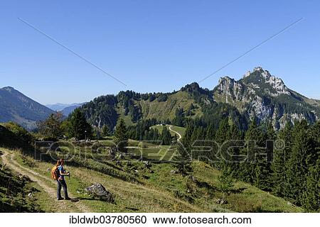 "Hiker on the way to the Hochplatte before Kampenwand, Chiemgau, Upper Bavaria, Bavaria, Germany, Europe" View Large Photo Image Stock Image - "Hiker on the way to the Hochplatte before Kampenwand, Chiemgau, Upper Bavaria, Bavaria, Germany, Europe". Fotosearch