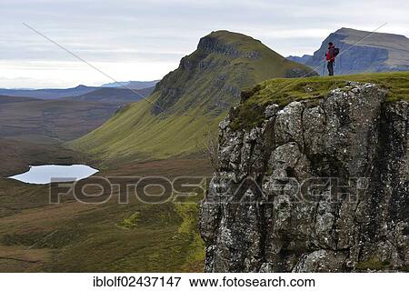 "Hiker standing in a volcanic landscape, Loch Leum na Luirginn, Flodigarry, The Table, Highlands, Isle of Skye, Scotland, United Kingdom, Europe" View Large Photo Image Stock Photo - "Hiker standing in a volcanic landscape, Loch Leum na Luirginn, Flodigarry, The Table, Highlands, Isle of Skye, Scotland, United Kingdom, Europe". Fotosearch
