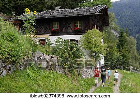 "Hiker walking in front of a farmhouse, Bad Dreikirchen near Barbian, Eisack Valley, province of Bolzano-Bozen, Alto Adige, Italy, Europe" View Large Photo Image Stock Photo - "Hiker walking in front of a farmhouse, Bad Dreikirchen near Barbian, Eisack Valley, province of Bolzano-Bozen, Alto Adige, Italy, Europe". Fotosearch