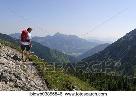 "Hiker walking on the trail leading to Taubenstein mountain, Lake Spitzingsee area, Upper Bavaria, Bavaria, Germany, Europe" View Large Photo Image Stock Photograph - "Hiker walking on the trail leading to Taubenstein mountain, Lake Spitzingsee area, Upper Bavaria, Bavaria, Germany, Europe". Fotosearch