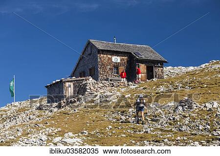 Stock Photography - "Hikers at Edelweisserhuette refuge, Tennengebirge, Pongau, Salzburg state, Austria, Europe". Fotosearch
