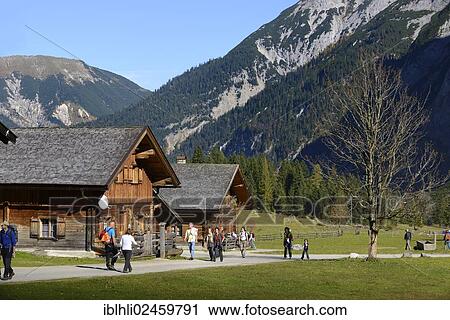 "Hikers at Eng, Alpine cabins or chalets, Eng Alm, Grosser Ahornboden, alpine pasture with sycamore maple trees, Karwendel Mountains, Risstal Valley, Tyrol, Austria, Europe, PublicGround, Europe" View Large Photo Image Stock Image - "Hikers at Eng, Alpine cabins or chalets, Eng Alm, Grosser Ahornboden, alpine pasture with sycamore maple trees, Karwendel Mountains, Risstal Valley, Tyrol, Austria, Europe, PublicGround, Europe". Fotosearch