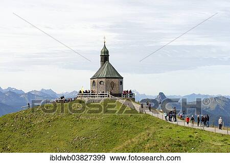 "Hikers at Heilige Kreuzerhohung chapel, Wallberg mountain, Tegernsee Mountains, Upper Bavaria, Bavaria, Germany, Europe" View Large Photo Image Stock Photo - "Hikers at Heilige Kreuzerhohung chapel, Wallberg mountain, Tegernsee Mountains, Upper Bavaria, Bavaria, Germany, Europe". Fotosearch