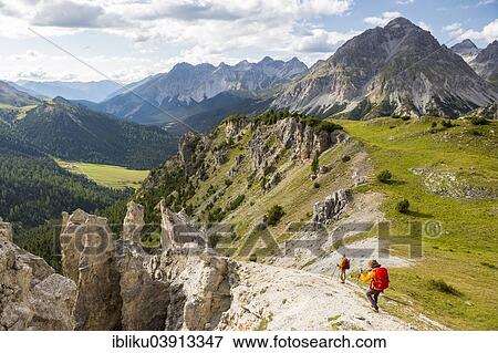"Hikers at Il Jalet, viewpoint over the Fuorn Pass, Swiss National Park, Graubunden, Switzerland, Europe" View Large Photo Image Stock Photo - "Hikers at Il Jalet, viewpoint over the Fuorn Pass, Swiss National Park, Graubunden, Switzerland, Europe". Fotosearch