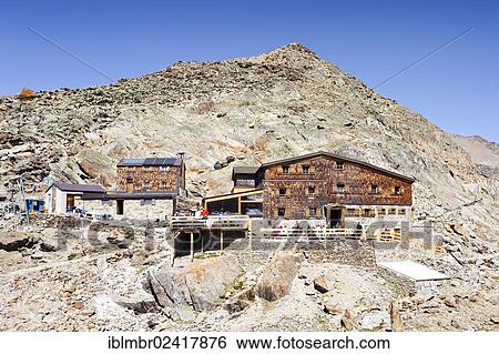 Stock Photograph - Hikers at Similaunhuette mountain shelter, below Niederjochferner mountain, Schnalstal valley, province of Bolzano-Bozen, Italy, Europe. Fotosearch