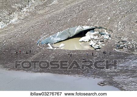 "Hikers at the hole of collapsed ice in Pasterze Glacier, Grossglockner, Hohe Tauern National Park, Tyrol, Austria, Europe" View Large Photo Image Stock Photo - "Hikers at the hole of collapsed ice in Pasterze Glacier, Grossglockner, Hohe Tauern National Park, Tyrol, Austria, Europe". Fotosearch