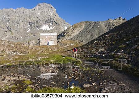 "Hikers at the Rifugio Gastaldi refuge, Mt Uia di Bessanese at back, Lanzo Valleys, Graian Alps, Province of Turin, Piedmont region, Italy, Europe" View Large Photo Image Picture - "Hikers at the Rifugio Gastaldi refuge, Mt Uia di Bessanese at back, Lanzo Valleys, Graian Alps, Province of Turin, Piedmont region, Italy, Europe". Fotosearch