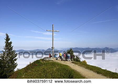 "Hikers at the summit cross, Brauneck Mountain, Isarwinkel, Lenggries, Upper Bavaria, Bavaria, Germany, Europe" View Large Photo Image Stock Image - "Hikers at the summit cross, Brauneck Mountain, Isarwinkel, Lenggries, Upper Bavaria, Bavaria, Germany, Europe". Fotosearch