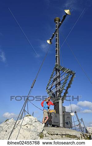 "Hikers at the summit cross on the summit of Kampenwand Mountain, Chiemgau, Bavaria, Germany, Europe" View Large Photo Image Stock Photo - "Hikers at the summit cross on the summit of Kampenwand Mountain, Chiemgau, Bavaria, Germany, Europe". Fotosearch