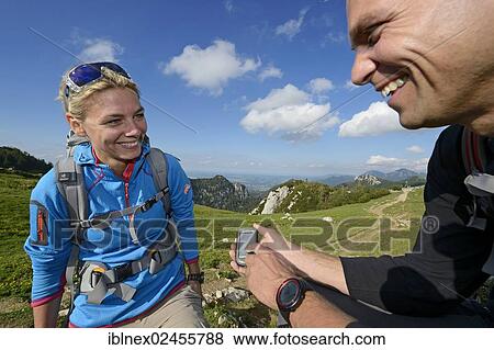 "Hikers checking a GPS device, Chiemgau, Bavaria, Germany, Europe" View Large Photo Image Stock Photo - "Hikers checking a GPS device, Chiemgau, Bavaria, Germany, Europe". Fotosearch