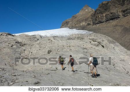 "Hikers crossing the exposed bedrock of Tsanfleuron Glacier, Canton of Valais, Switzerland, Europe" View Large Photo Image Stock Photograph - "Hikers crossing the exposed bedrock of Tsanfleuron Glacier, Canton of Valais, Switzerland, Europe". Fotosearch