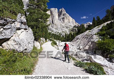 Picture - "Hikers during the ascent to Kesselkogel Mountain above the Rifugio Gardecia hut, Rosengarten Group at the rear, Trentino, Italy, Europe". Fotosearch