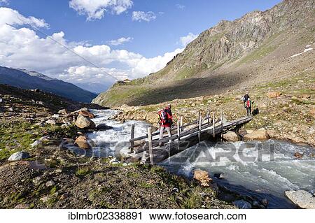 "Hikers during the descent from Zufallferner Glacier to Marteller Huette hut, at the rear, in the Martell Valley, Alto Adige, Italy, Europe" View Large Photo Image Stock Image - "Hikers during the descent from Zufallferner Glacier to Marteller Huette hut, at the rear, in the Martell Valley, Alto Adige, Italy, Europe". Fotosearch