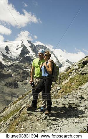 "Hikers enjoying the view of Grossglockner mountain, Hohe Tauern mountain range, Austria, Europe" View Large Photo Image Picture - "Hikers enjoying the view of Grossglockner mountain, Hohe Tauern mountain range, Austria, Europe". Fotosearch