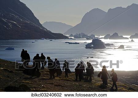 "Hikers in front of fjord scenery in Vest Frederiksdal, Nordbugten, Scoresbysund, Sermersooq, Greenland, North America" View Large Photo Image Stock Image - "Hikers in front of fjord scenery in Vest Frederiksdal, Nordbugten, Scoresbysund, Sermersooq, Greenland, North America". Fotosearch