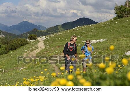 "Hikers in front of Hochplatte Mountain, Chiemgau, Bavaria, Germany, Europe" View Large Photo Image Stock Image - "Hikers in front of Hochplatte Mountain, Chiemgau, Bavaria, Germany, Europe". Fotosearch