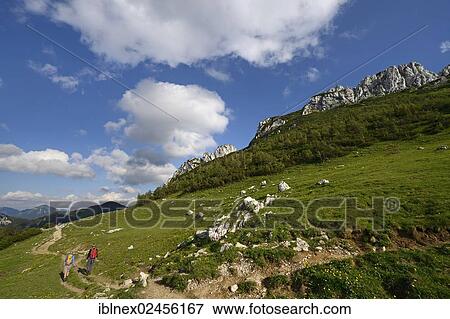 "Hikers in front of Kampenwand Mountain, Chiemgau, Bavaria, Germany, Europe" View Large Photo Image Stock Photo - "Hikers in front of Kampenwand Mountain, Chiemgau, Bavaria, Germany, Europe". Fotosearch
