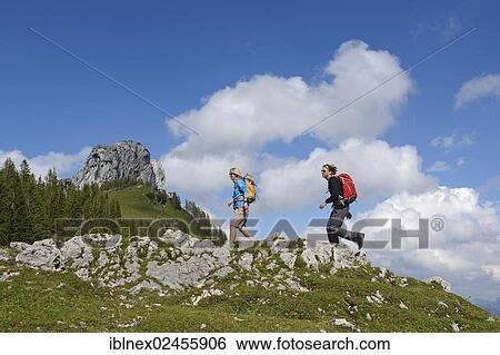"Hikers in front of Kampenwand Mountain, Chiemgau, Bavaria, Germany, Europe" View Large Photo Image Stock Photograph - "Hikers in front of Kampenwand Mountain, Chiemgau, Bavaria, Germany, Europe". Fotosearch