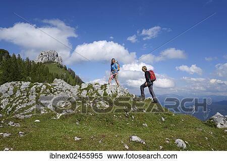 "Hikers in front of Kampenwand Mountain, Chiemgau, Bavaria, Germany, Europe" View Large Photo Image Stock Photography - "Hikers in front of Kampenwand Mountain, Chiemgau, Bavaria, Germany, Europe". Fotosearch