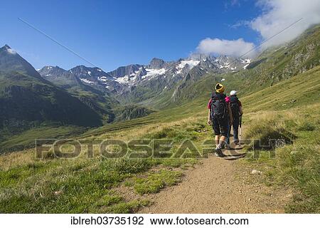 "Hikers in Seewertal valley, mountains Hoher First and Granatenkogel at back, Seewertal, Otztaler Alpen, South Tyrol province, Trentino-Alto Adige, Italy, Europe" View Large Photo Image Stock Image - "Hikers in Seewertal valley, mountains Hoher First and Granatenkogel at back, Seewertal, Otztaler Alpen, South Tyrol province, Trentino-Alto Adige, Italy, Europe". Fotosearch