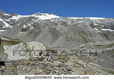 "Hikers in the rocky terrain below the summit of Wildhorn Mountain, Bernese Alps, Canton of Valais, Switzerland, Europe" View Large Photo Image Stock Image - "Hikers in the rocky terrain below the summit of Wildhorn Mountain, Bernese Alps, Canton of Valais, Switzerland, Europe". Fotosearch