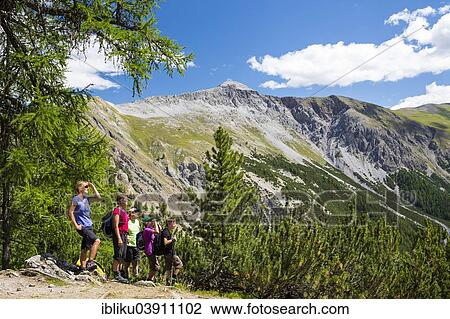 "Hikers in the Val Cluozza valley, Swiss National Park, Graubunden, Switzerland, Europe" View Large Photo Image Stock Image - "Hikers in the Val Cluozza valley, Swiss National Park, Graubunden, Switzerland, Europe". Fotosearch
