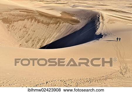 Hikers leaving tracks in the sand, Great Sand Dunes National Park in Mosca, Colorado, USA View Large Photo Image Stock Photo - Hikers leaving tracks in the sand, Great Sand Dunes National Park in Mosca, Colorado, USA. Fotosearch