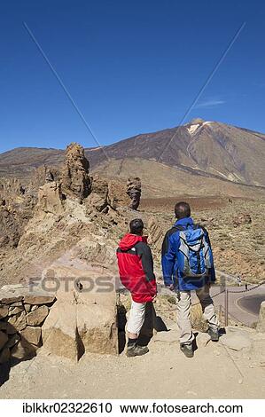 Stock Image - "Hikers, Los Roques in the Parque Nacional del Teide, Tenerife, Canary Islands, Spain, Europe". Fotosearch