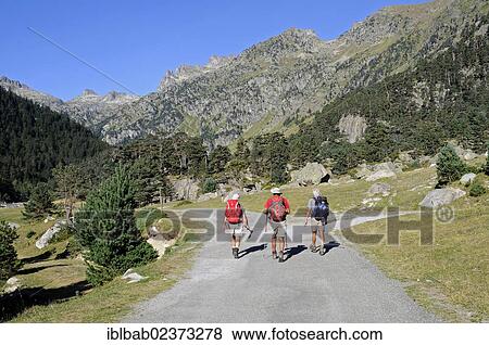 Stock Photo - "Hikers, mountain landscape near lake Lac de Gaube, Cauterets, Midi-Pyrenees region, Pyrenees, national park, Hautes-Pyrenees department, France, Europe, PublicGround, Europe". Fotosearch