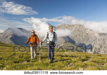 "Hikers on Murter Pass 2545 m, the transition from the Val Cluozza valley to the Val dal Spol valley, Swiss National Park, Graubunden, Switzerland, Europe" View Large Photo Image Stock Photo - "Hikers on Murter Pass 2545 m, the transition from the Val Cluozza valley to the Val dal Spol valley, Swiss National Park, Graubunden, Switzerland, Europe". Fotosearch