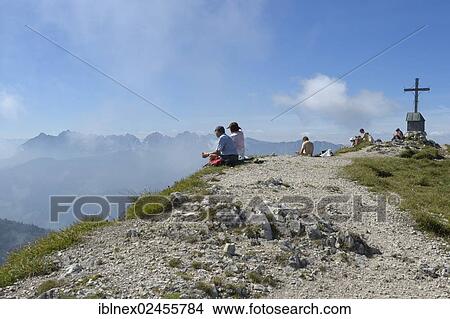 "Hikers on the summit of Geigelstein Mountain, Chiemgau, Bavaria, Germany, Europe" View Large Photo Image Picture - "Hikers on the summit of Geigelstein Mountain, Chiemgau, Bavaria, Germany, Europe". Fotosearch