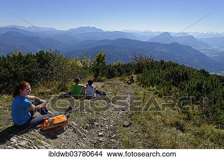 "Hikers resting at the top of the Hochplatte, Chiemgau, Upper Bavaria, Bavaria, Germany, Europe" View Large Photo Image Picture - "Hikers resting at the top of the Hochplatte, Chiemgau, Upper Bavaria, Bavaria, Germany, Europe". Fotosearch