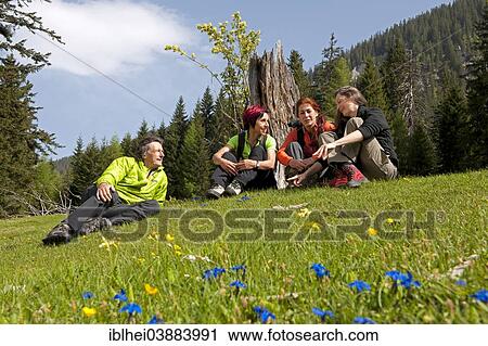 "Hikers resting on a mountain pasture, Gesause region, Styria, Austria, Europe" View Large Photo Image Stock Image - "Hikers resting on a mountain pasture, Gesause region, Styria, Austria, Europe". Fotosearch