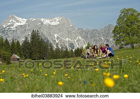 "Hikers sitting on the mountain pasture, Gesause region, Styria, Austria, Europe" View Large Photo Image Picture - "Hikers sitting on the mountain pasture, Gesause region, Styria, Austria, Europe". Fotosearch
