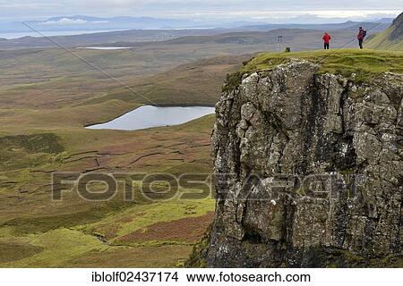 "Hikers standing in a volcanic landscape, Loch Leum na Luirginn, Flodigarry, Highlands, Isle of Skye, Scotland, United Kingdom, Europe" View Large Photo Image Picture - "Hikers standing in a volcanic landscape, Loch Leum na Luirginn, Flodigarry, Highlands, Isle of Skye, Scotland, United Kingdom, Europe". Fotosearch