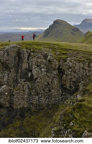 "Hikers standing in a volcanic landscape, Loch Leum na Luirginn, Flodigarry, Highlands, Isle of Skye, Scotland, United Kingdom, Europe" View Large Photo Image Stock Image - "Hikers standing in a volcanic landscape, Loch Leum na Luirginn, Flodigarry, Highlands, Isle of Skye, Scotland, United Kingdom, Europe". Fotosearch