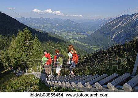 Picture - "Hikers walking down the stairway leading to the Purtschellerhaus mountain hut on Hoher Goll mountain, Bayerischer Weg trail, Berchtesgadener Land district, Upper Bavaria, Bavaria, Germany, Europe". Fotosearch