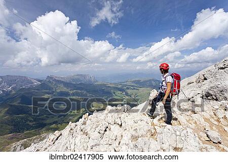 Hikers walking on the summit ridge, climbing to the summit of Plattkofel mountain via the Oskar Schuster Stieg trail, fixed rope route, Dolomites, province of Bolzano-Bozen, Italy, Europe View Large Photo Image Stock Photography - Hikers walking on the summit ridge, climbing to the summit of Plattkofel mountain via the Oskar Schuster Stieg trail, fixed rope route, Dolomites, province of Bolzano-Bozen, Italy, Europe. Fotosearch