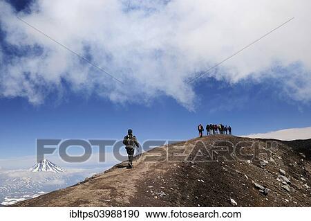 "Hiking group on the volcanic crater, Gorely volcano, Kamchatka, Russia, Europe" View Large Photo Image Stock Image - "Hiking group on the volcanic crater, Gorely volcano, Kamchatka, Russia, Europe". Fotosearch