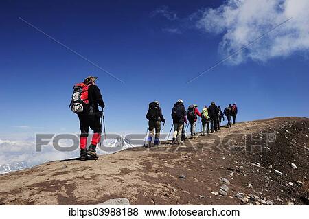 "Hiking group on the volcanic crater, Gorely volcano, Kamchatka, Russia, Europe" View Large Photo Image Stock Photo - "Hiking group on the volcanic crater, Gorely volcano, Kamchatka, Russia, Europe". Fotosearch